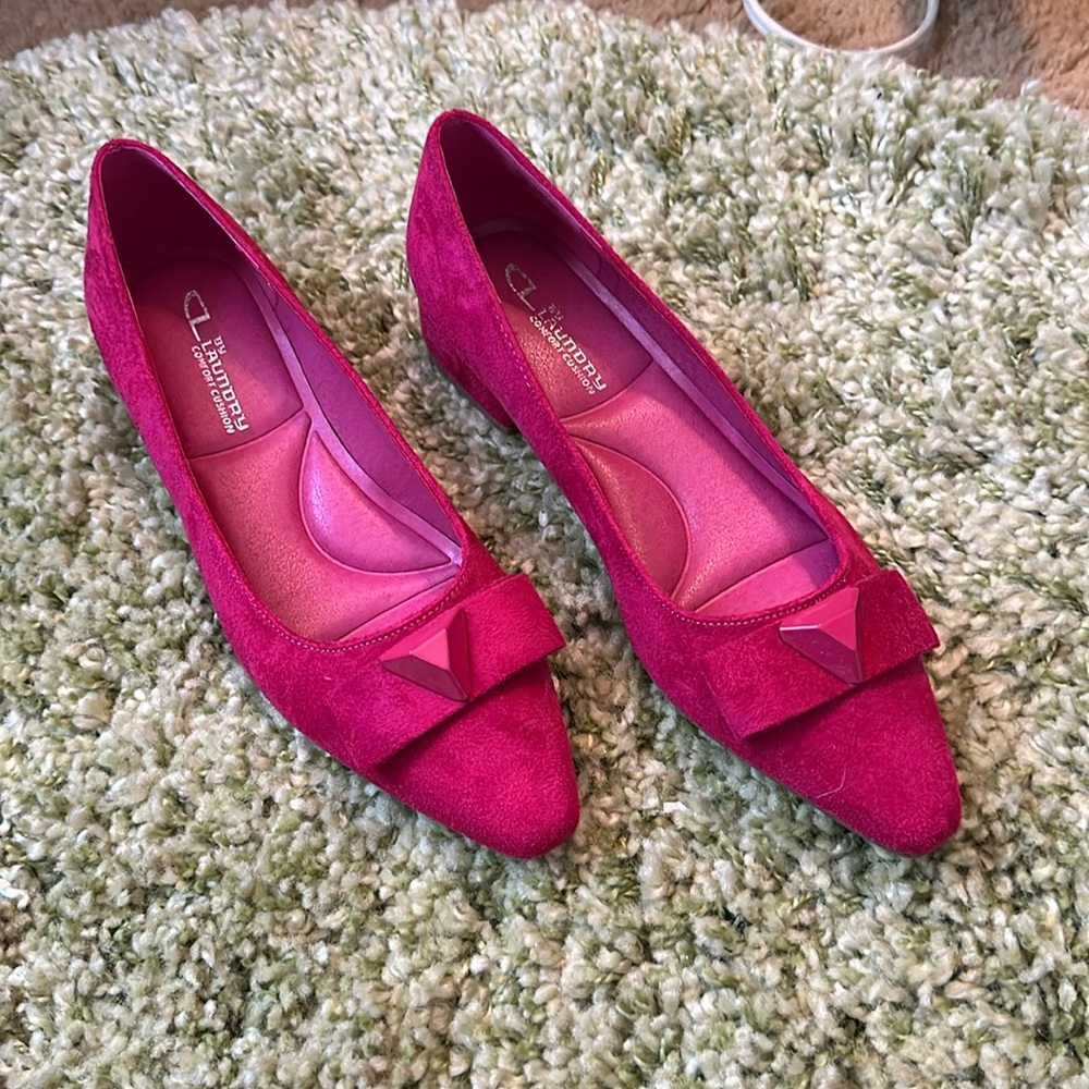 Deep pink suade shoes.